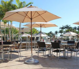 outdoor chairs, tables, and umbrellas