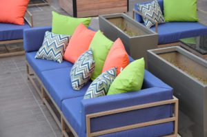 outdoor blue sofa with many pillows