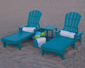 two lounge chairs at a beach
