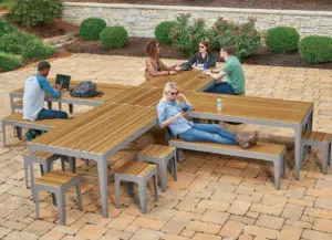 group of people sitting at outdoor tables